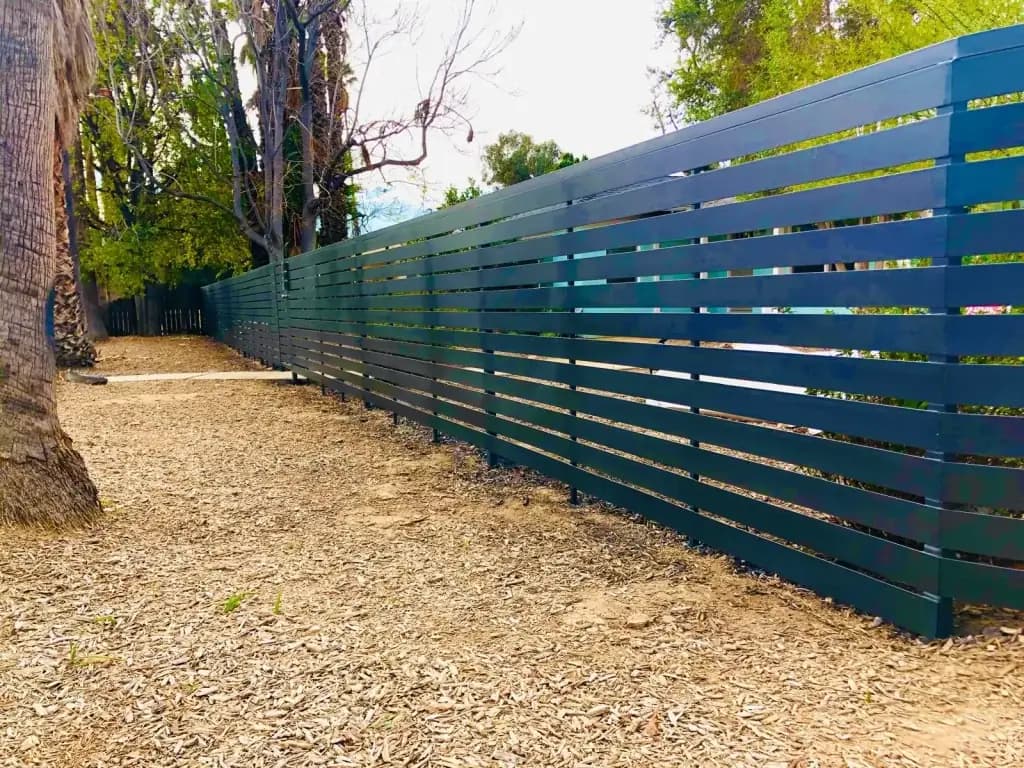 Horizontal-slat metal fence