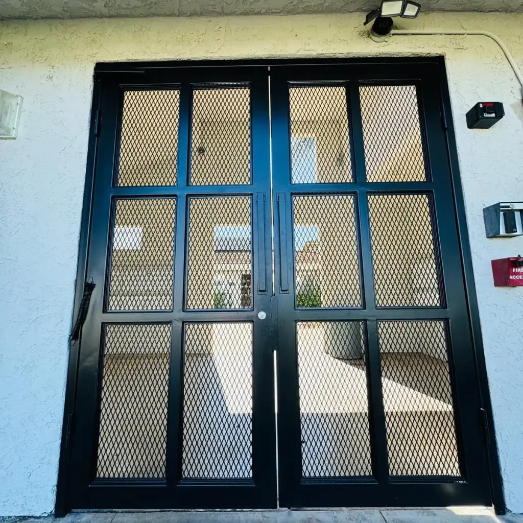 Dark horizontal-slat driveway gate